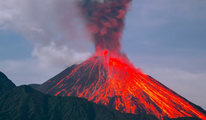 What causes volcanoes to erupt